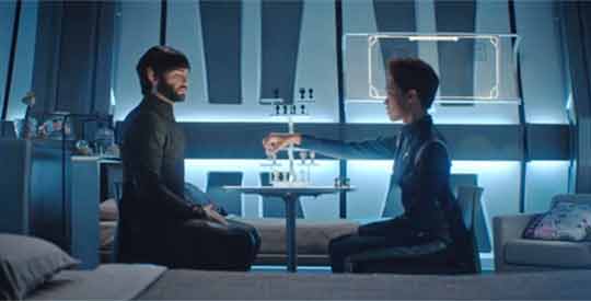Spock and Burnham play chess.